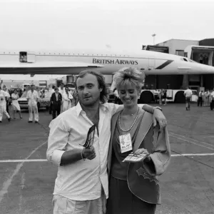 Singer Phil Collins & wife Jill Travelman at London Heathrow Airport Singer Phil Collins & wife Jill Travelman at London Heathrow Airport