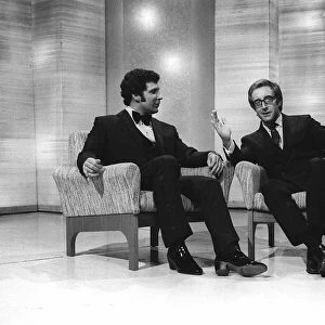 Singer Tom Jones with Actor Peter Sellers on a chat show - Sellers gestures with his