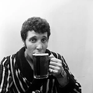 Singer Tom Jones drinking a pint of beer at Cesars Palace Nightclub