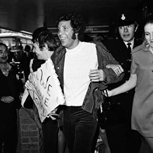 Singer Tom Jones was welcomed home today at Heathrow Airport when he arrived back from a