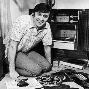 Singer Vince Hill seen here looking through his record collection at home. 3rd March 1967