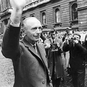 Sir Alec Douglas Home faces a battery of cameras on his return from Buckingham Palace