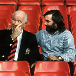 SIR MATT BUSBY AND GEORGE BEST SEATED IN FOOTBALL STANDS OF OLD TRAFFORD. 2 / 10 / 90