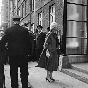 Sir Winston Churchill goes home again from hospital, pictured, his wife Lady Churchill