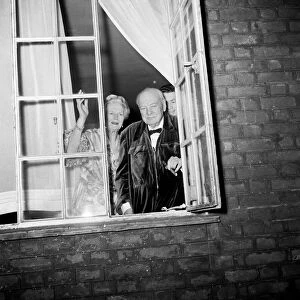 Sir Winston Churchill and Lady Churchill look from the window of his London home in Hyde