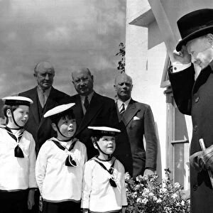Sir Winston Churchill - May 1959 British Prime Minister raises his hat to 3 young