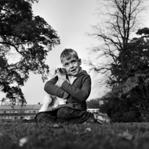 Six-year-old Richard Brown with his miniature white Poodle Dewdrop Six-year-old Richard Brown with his miniature white Poodle Dewdrop