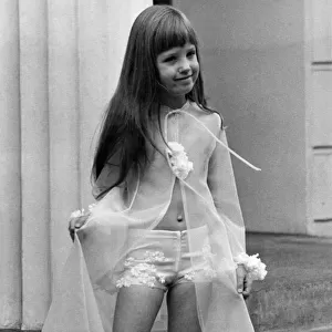 Six-year-old Yasmin Pennial models a see-through negligee
