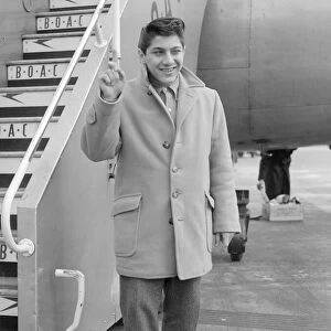 Sixteen year old Canadian singer songwriter Paul Anka pictured on his arrival in Britain