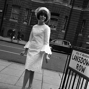 Sixties Fashion by Kiki Byrne Model wearinf white dress with wide sleeves