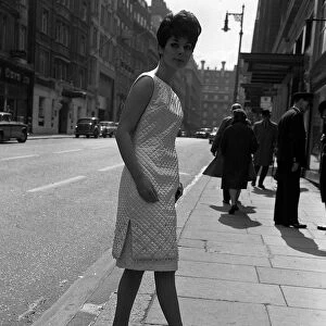 Sixties Fashion by Kiki Byrne Model wearing white dress with slits to the thigh