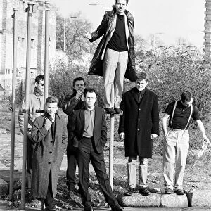 Ska group Madness pose in London whilst filming their new video. 30th January 1984