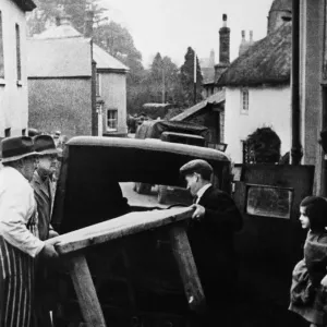 Slapton butcher moving the contents of his shop prior to completion of the evacuation of Slapton butcher moving the contents of his shop prior to completion of the evacuation of