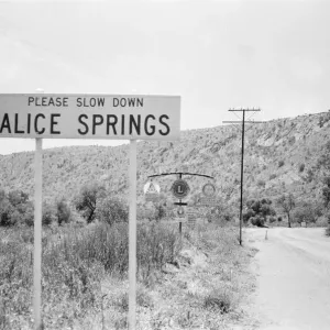 Slow down sign at the entrance to the town of Alice Springs, Australia. 1st February 1976