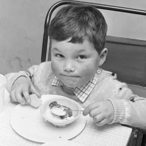 A small boy enjoying his jelly and ice cream during the Birch Copse School Christmas A small boy enjoying his jelly and ice cream during the Birch Copse School Christmas