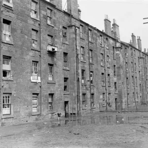 Print of a boy playing in Glasgow tenements, 1956