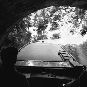 A small pleasure craft seen here emerging from the Chirk Tunnel on the Llangollen Canal