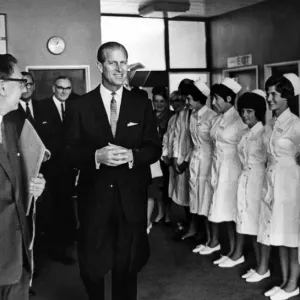 A smiling Prince Philip and smiling nurses as he leaves the Dental Hospital