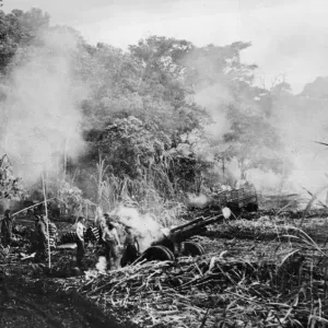 The smoke had barely cleared away when this picture of a US Marine 105 mm gun crew in The smoke had barely cleared away when this picture of a US Marine 105 mm gun crew in