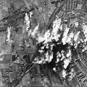 Smoke rises from the steel & engineering works at Lille in France during WW2 bombing raid