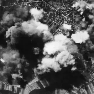 Smoke spouts up from the Nazi repair and equipment aerodrome at Werl, east of Dortmund
