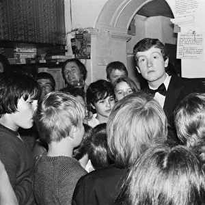 Snooker player Steve Davis with a group of young fans. 8th June 1981