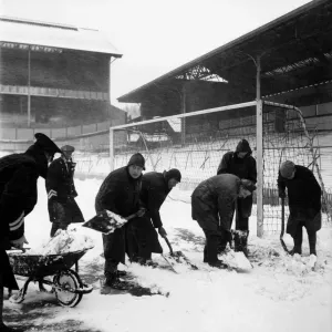 Snow Scene. Ground staff at White Hart Lane clearing the pitch for the FA Cup semi final Snow Scene. Ground staff at White Hart Lane clearing the pitch for the FA Cup semi final