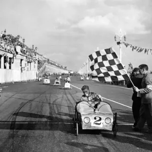 Soapbox winner rattles past. On every conceivable contraption that can be pedalled Soapbox winner rattles past. On every conceivable contraption that can be pedalled