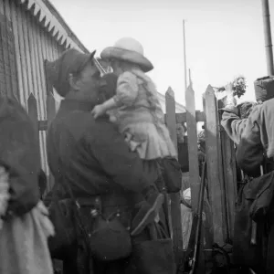 A soldier of the French 6th Army says goodbye to his daughter at Le Harve before moving