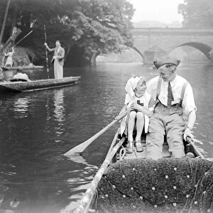A soldier home from the front goes for a punt with his daughter down the river during