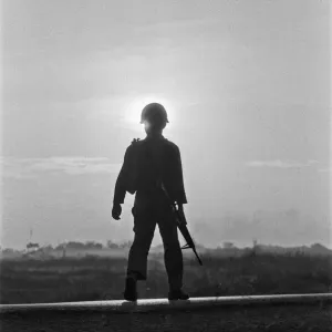 A soldier of the South Vietnamese army advances on Viet Cong positions in Trang Bang just A soldier of the South Vietnamese army advances on Viet Cong positions in Trang Bang just