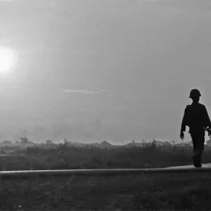 A soldier of the South Vietnamese army advances on Viet Cong positions in Trang Bang just A soldier of the South Vietnamese army advances on Viet Cong positions in Trang Bang just