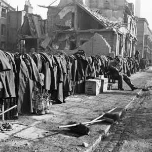 Soldiers discarded tunics and coats as they help with the clean up of Chelsea following Soldiers discarded tunics and coats as they help with the clean up of Chelsea following