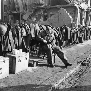 Soldiers discarded tunics and coats as they help with the clean up of Chelsea following Soldiers discarded tunics and coats as they help with the clean up of Chelsea following