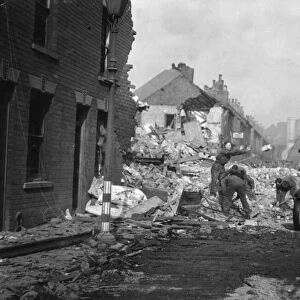 Soldiers help clear rubble from Rokeby Avenue, Hull following a heavy night time air raid
