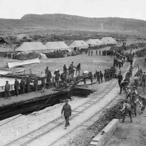 Soldiers making up a fatigue party seen here landing stores from a lighter whilst Soldiers making up a fatigue party seen here landing stores from a lighter whilst