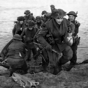 Soldiers of a Scottish infantry division of the British Army leave their assault craft Soldiers of a Scottish infantry division of the British Army leave their assault craft