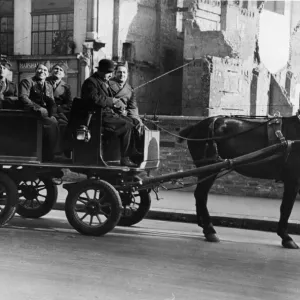 US soldiers see the sights of London from a converted milk wagon