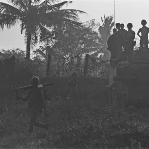Soldiers of the South Vietnamese army watch from the top of an armoured personnel carrier Soldiers of the South Vietnamese army watch from the top of an armoured personnel carrier