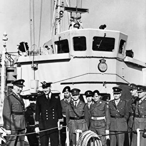 Soldiers of the Territorial Army meeting a Naval officer on board minesweeper HMS Mersey