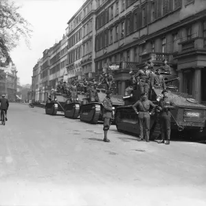 Soldiers wait by their Vickers Medium tanks, parked in Pont Street London Soldiers wait by their Vickers Medium tanks, parked in Pont Street London