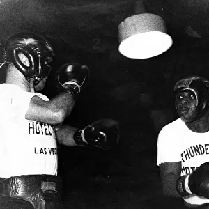 Sonny Liston displays his talents in a three-round work-out with sparring partner