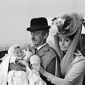 Sophia Loren and David Niven filming "Lady L"with baby Simon, aged 9 months