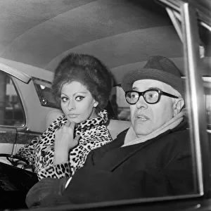 Sophia Loren and her husband Carlo Ponti arriving at London Airport. 15th January 1966