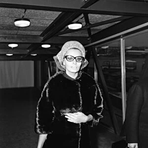 Sophia Loren leaving London Airport for Paris. November 1965