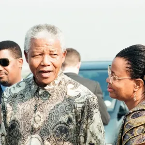 Nelson Mandela with Graca Machel at Heathrow Airport Print