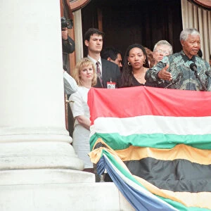 South African President Nelson Mandela addresses the crowds from the balcony of South