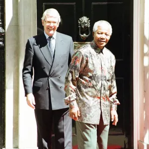South African President Nelson Mandela is welcomed by British Prime Minister John Major South African President Nelson Mandela is welcomed by British Prime Minister John Major