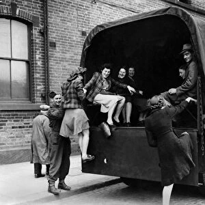 South York tram strikes. Girl munition workers being helped into an army lorry
