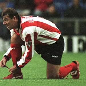 Southampton footballer Matthew Le Tissier putting on red boots during his side